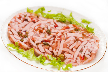 Jellied cooked sausage with vegetables
