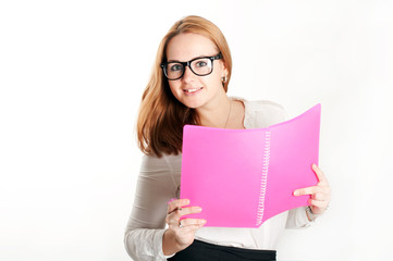 Girl with a pink folder on a light background