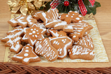 christmas gingerbreads and decoration on wooden table