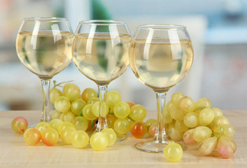 Fototapeta premium White wine in glass on room background