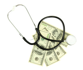 Healthcare cost concept: stethoscope and dollars isolated