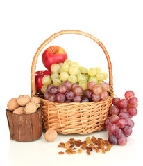 Grape in basket with nuts isolated on white