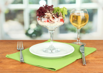 Delicatessen seafood salad with rice in glass