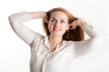 Fototapeta premium Brunette with her hair on a light background