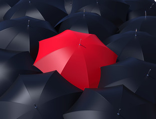 red umbrella and blacks umbrellas.