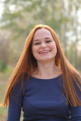 Fototapeta premium Attractive redhead in autumn