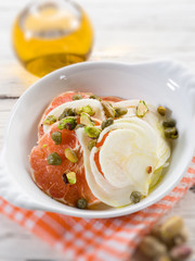 salad with grapefruit fennel and pistachio nuts, selective focus