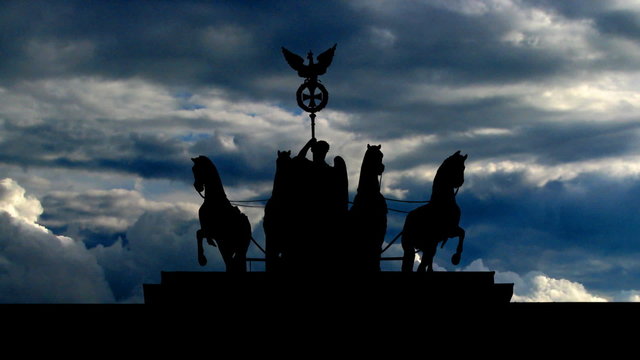 Germany The Brandenburg Gate sculpture clouds