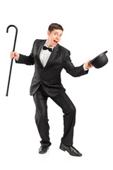 Young performer with cane and hat gesturing