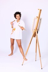 young smiling curly woman painter boyfriends shirt dressed