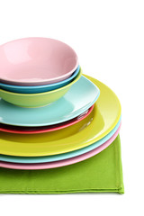 Colorful plates on napkin isolated on white