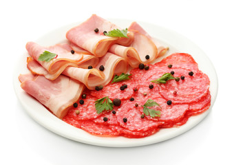 tasty bacon and sausage with spices on plate, isolated on white