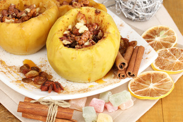Baked apples on plate close up