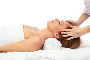 Portrait of beautiful woman taking head massage, isolated