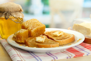 White bread toastwith honey on plate in cafe