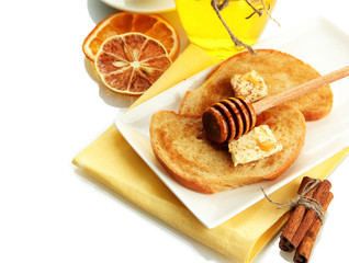 White bread toast with honey, isolated on white