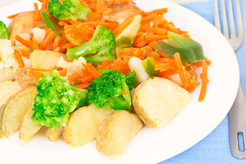 Mixed vegetables on a plate with fork