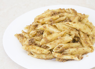 Italian penne pasta with chopped meat