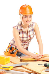 Female carpenter with helmet at work