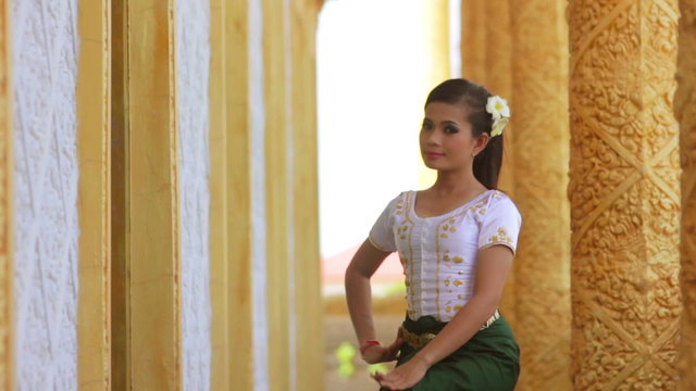 Beautiful Asian Girl performs cambodian folk dance in temple