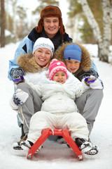 Family on sledge