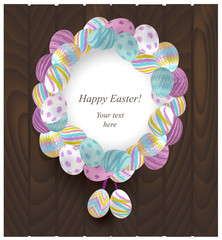 Colorful Easter Wreath on a wooden background