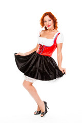 Naklejka premium young and beautiful woman in a traditional Bavarian dress