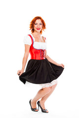 young and beautiful woman in a traditional Bavarian dress