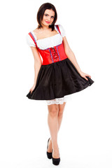 young and beautiful woman in a traditional Bavarian dress