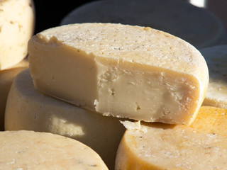 Different sorts of cheese at a market