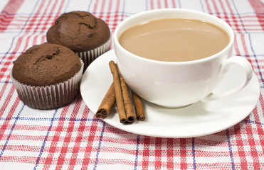 coffee with milk, cinnamon and muffins