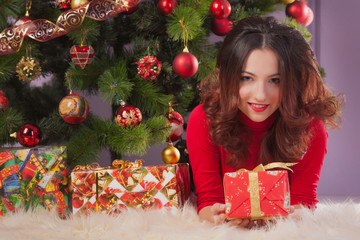 Girl near christmas tree