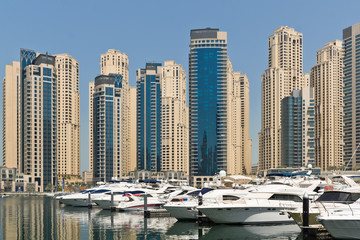 Obraz na płótnie Canvas Dubai Marina Yacht and Skyscrapers
