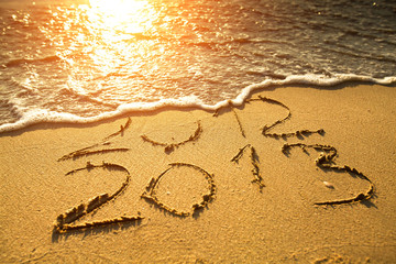New Year 2013 is coming!  2012 and 2013 on a beach sand.