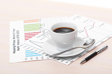 Accounting. Cup of coffee on document. chart and diagram