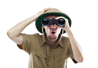 Amazed explorer looking through binoculars