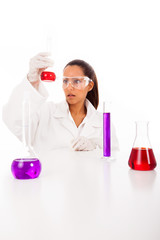 Female researcher checking test tubes, isolated on white