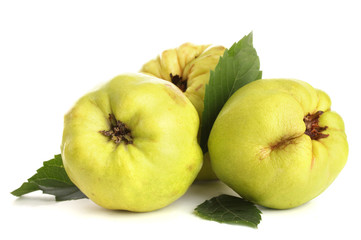 sweet quinces with leaves, isolated on white