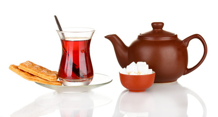 glass of Turkish tea and kettle isolated on white
