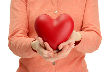 Fototapeta premium Red heart in woman hands, close up