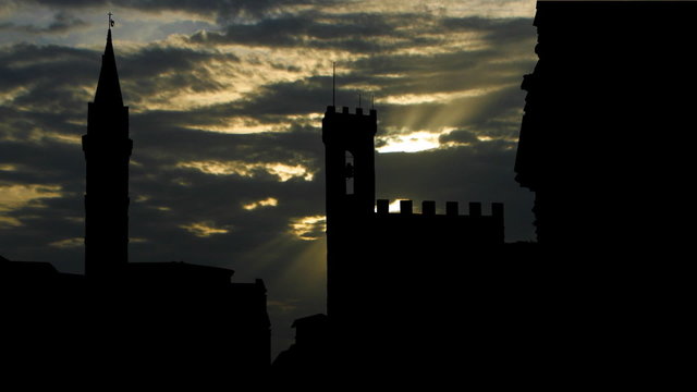 Italy Florence Badia Fiorentina and Bargello sun passing