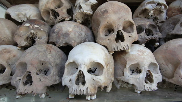 Skulls and bones in Killing field, cambodia, static camera