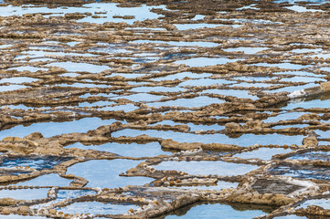 Salt pans near Qbajjar in Gozo, Malta.