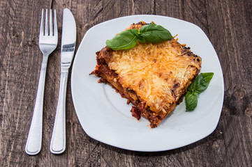 Plate with a piece of fresh made Lasagne