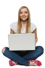 Naklejka premium Woman student sitting with laptop
