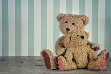 Two teddy bears hugging