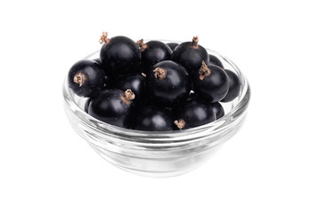 Fresh blackcurrant in glass bowl  isolated on  white