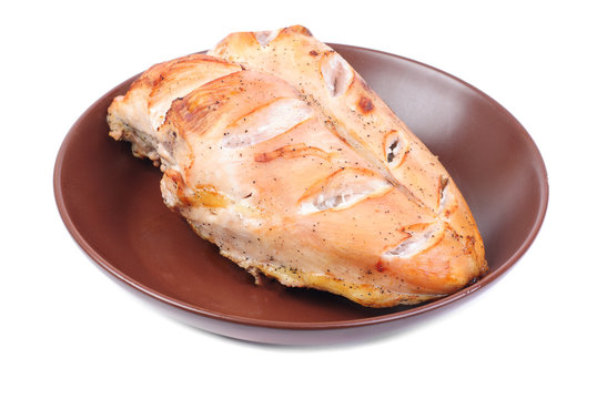 Grilled chicken breasts on a plate ,isolated