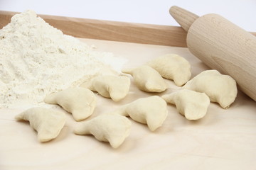 Fototapeta na wymiar Dumplings on a pastry board