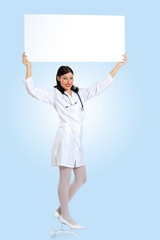 Young female doctor with a banner